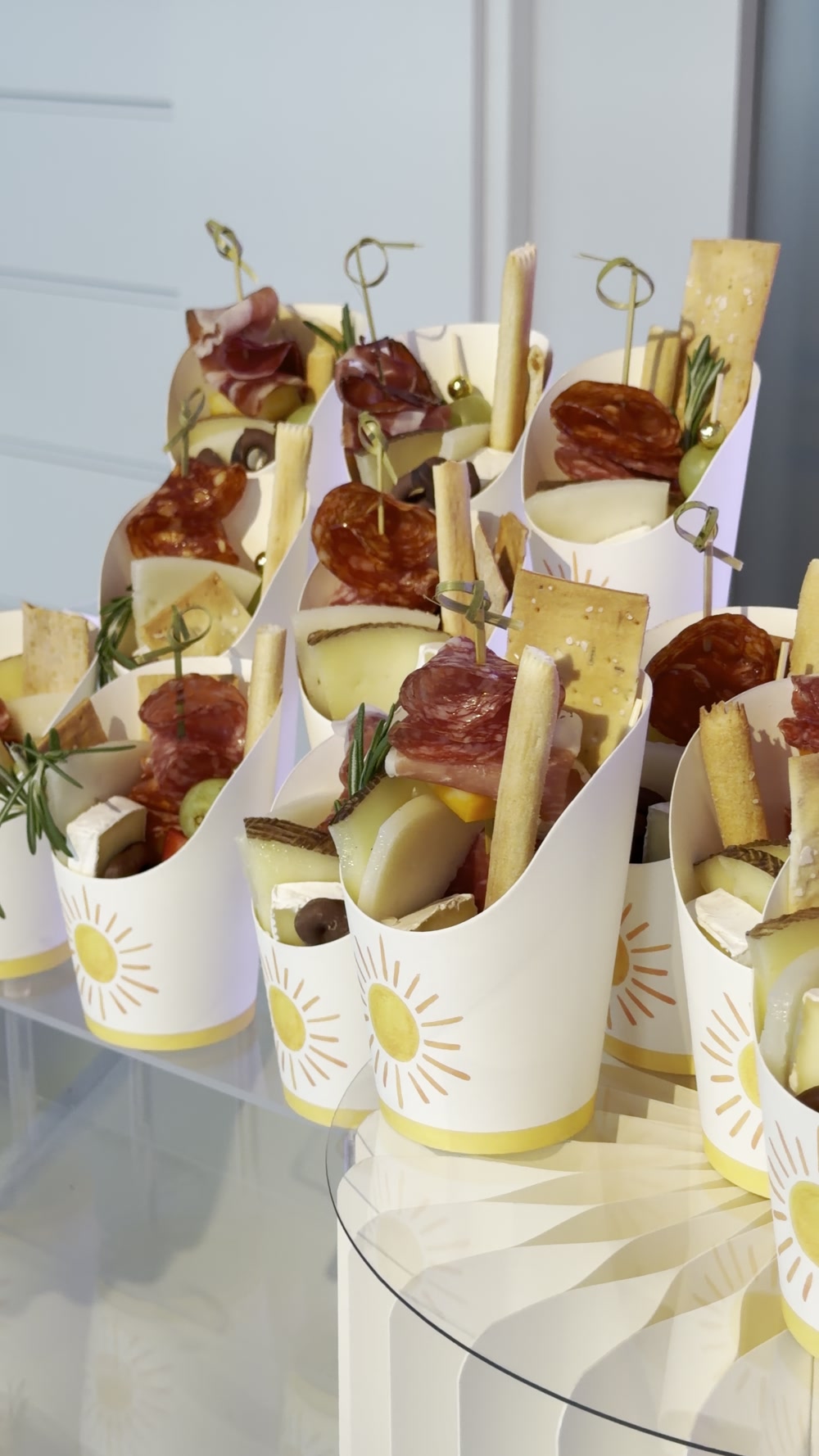 Individual grazing cups with cheeses, crackers and charcuterie for baby-shower guests