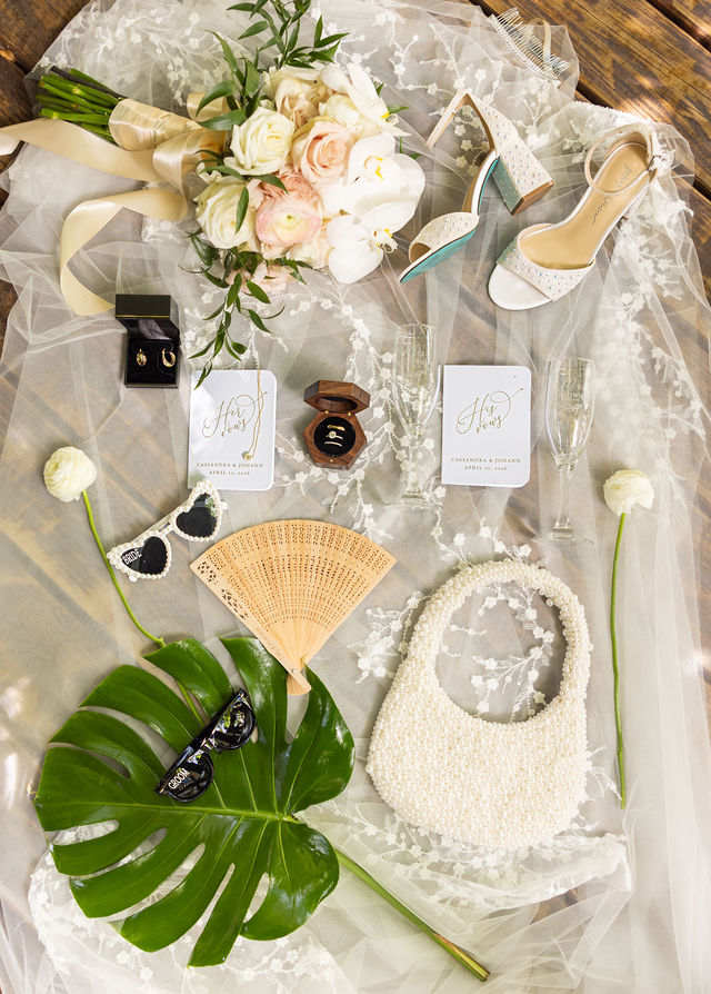 The couple’s bouquet, wedding rings and bridal accessories
