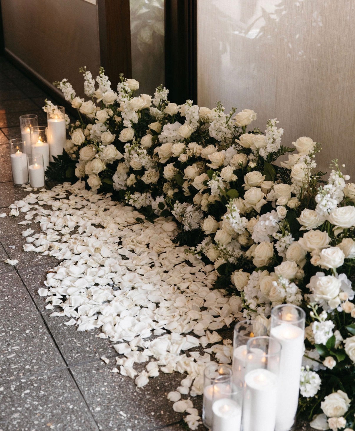A sweeping arrangement of white flowers and petals