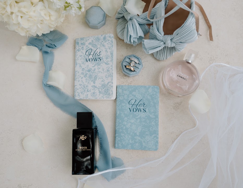 Blue vow books, bridal accessories and white flowers from the Dyer wedding