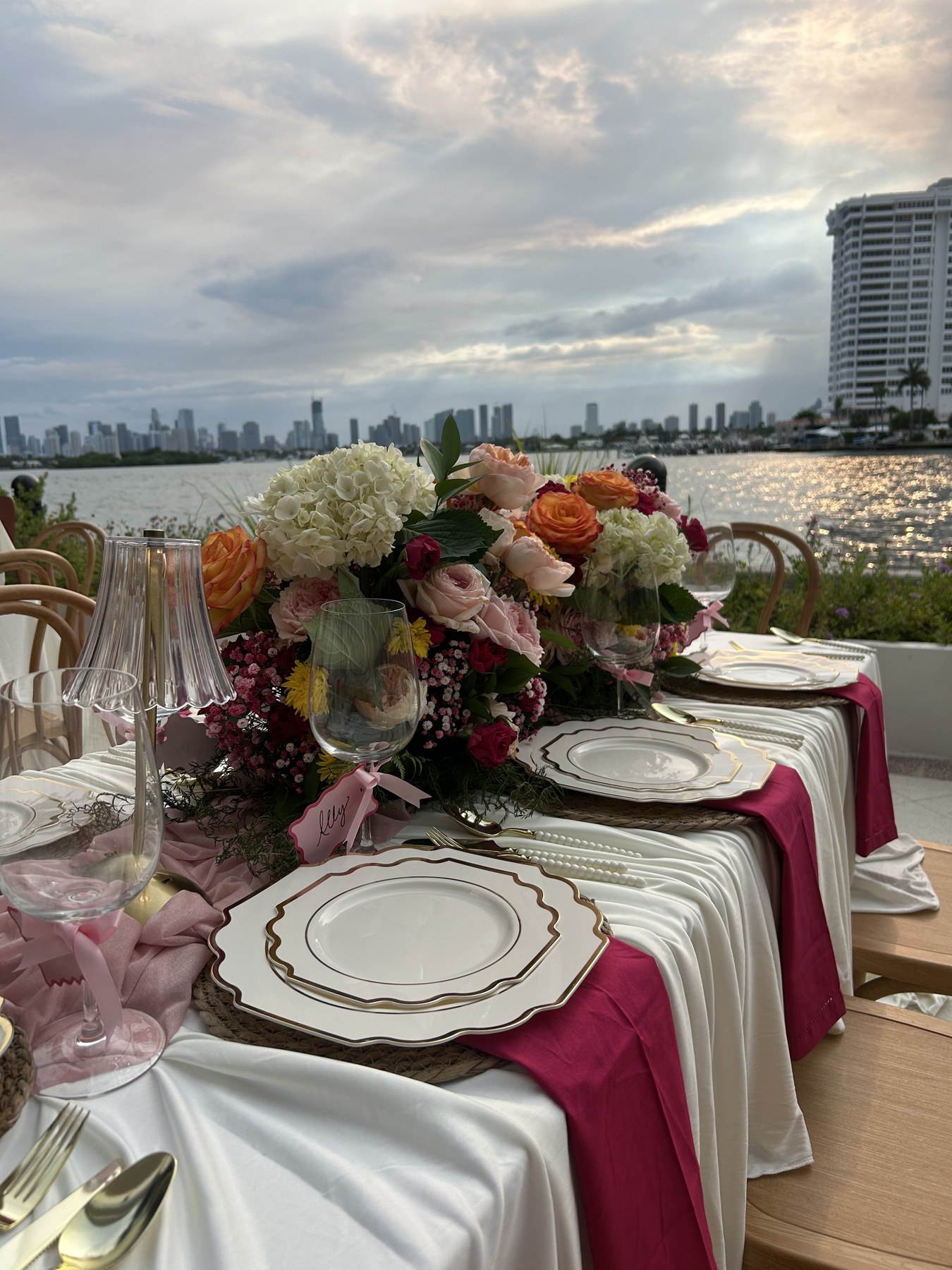 Colorful baby-shower florals and pink linens beside the Miami waterfront