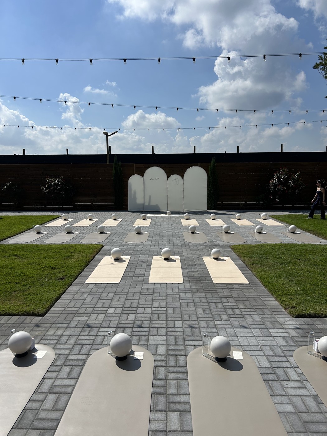Outdoor Pilates mats and exercise balls arranged for guests