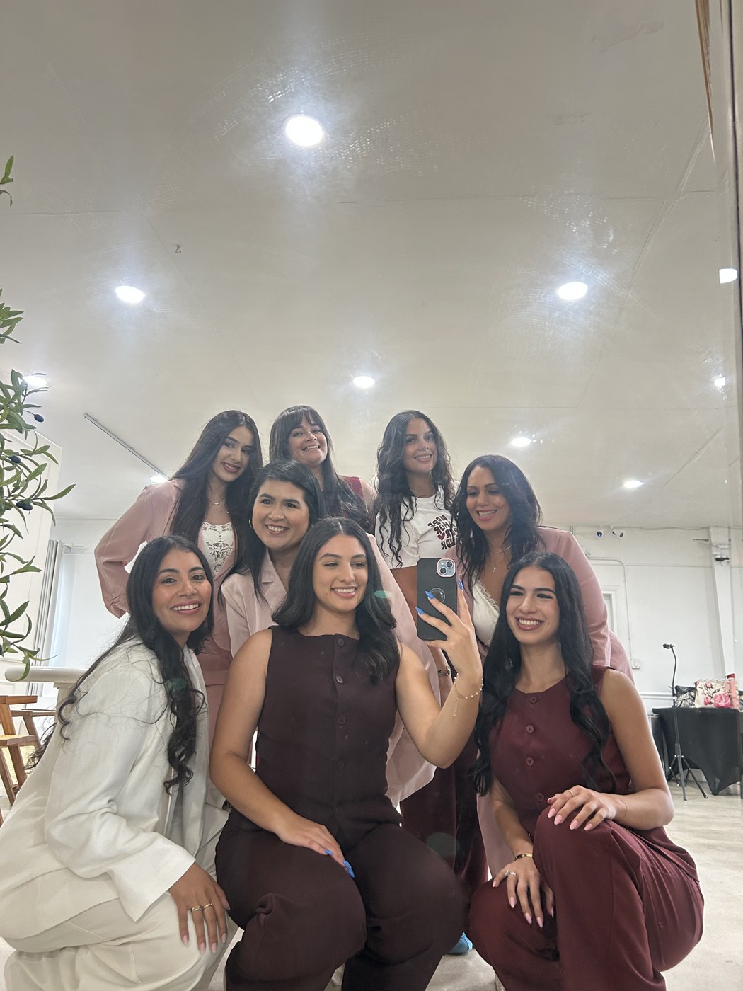 The team sharing a mirror selfie