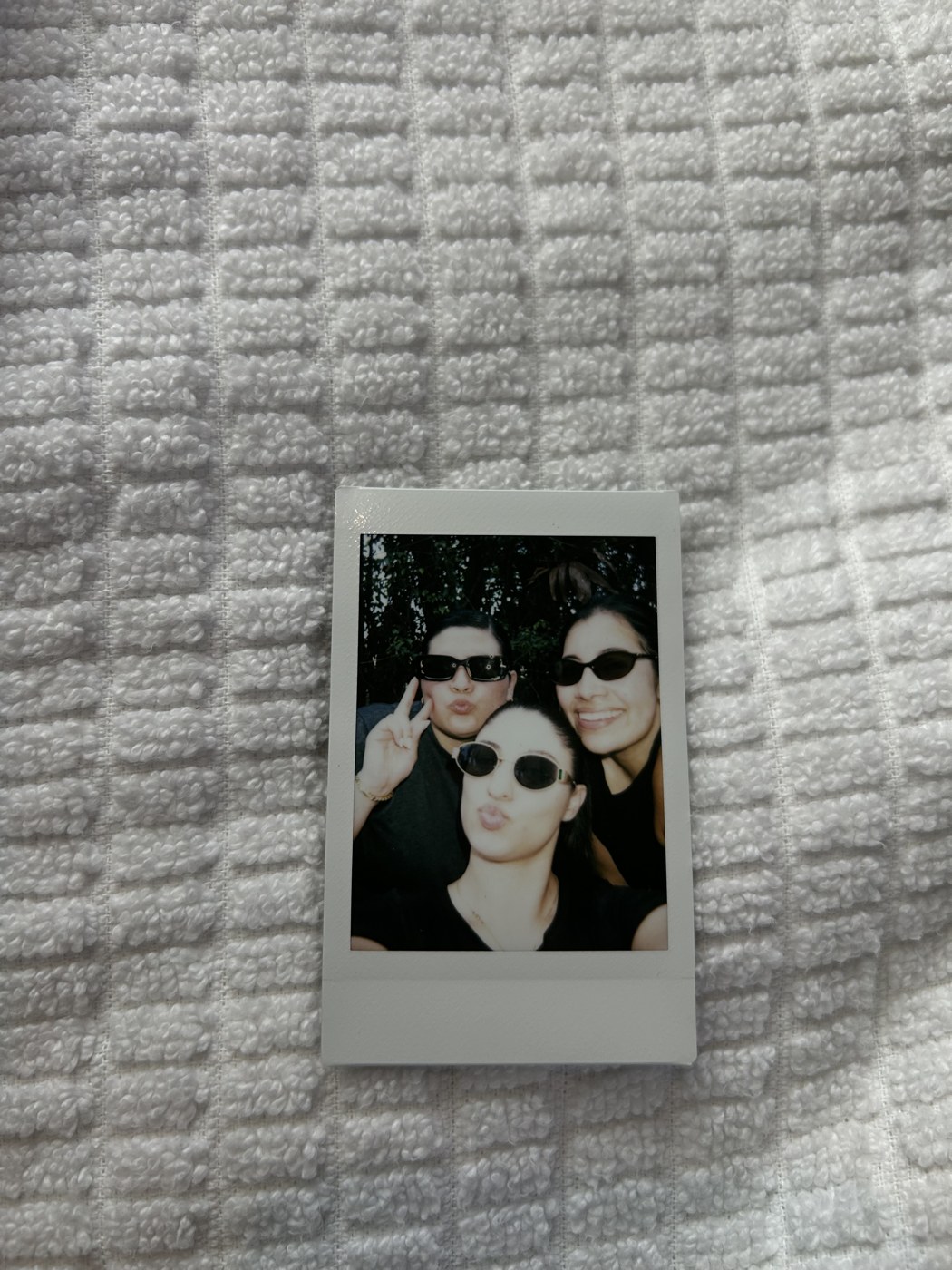 A playful instant photo of team members