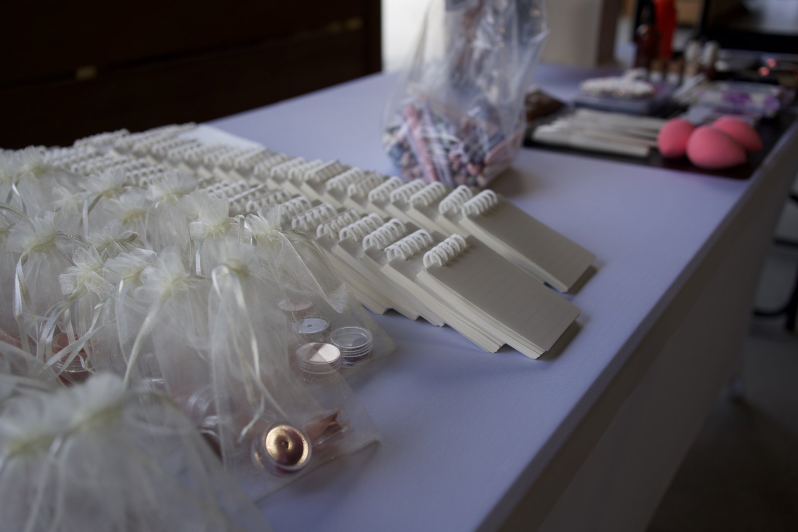 Notebooks and beauty favors arranged for wellness guests