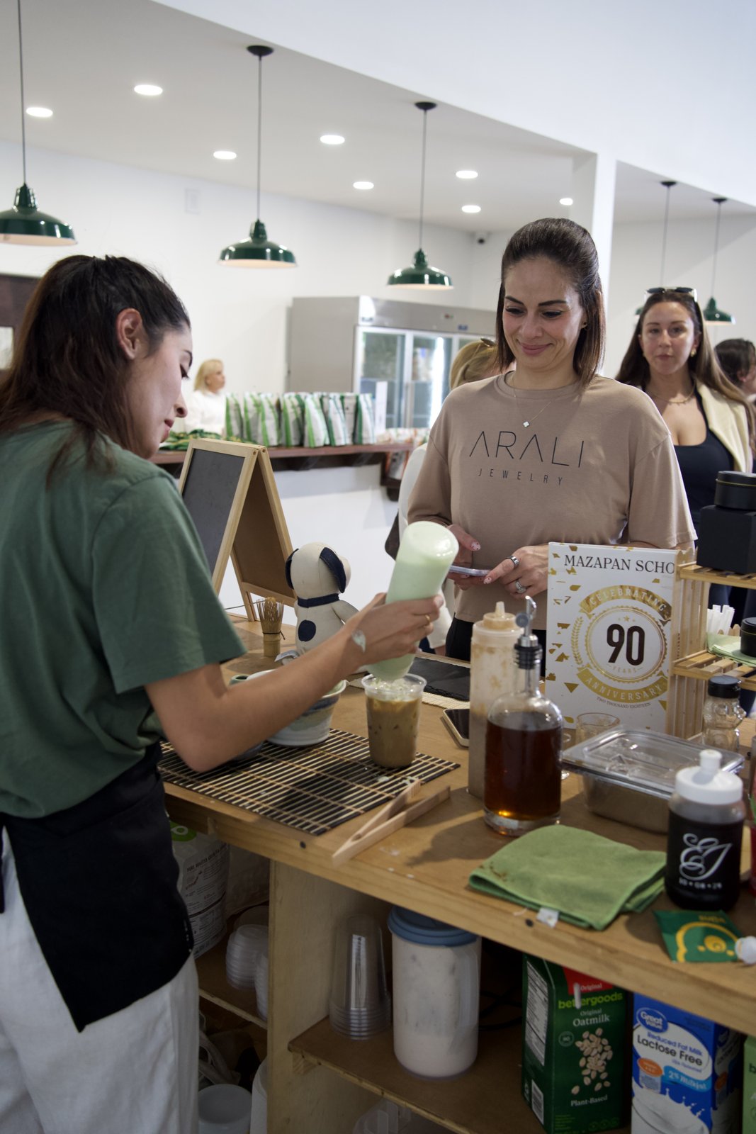 A guest enjoying a freshly prepared drink at the wellness pop-up